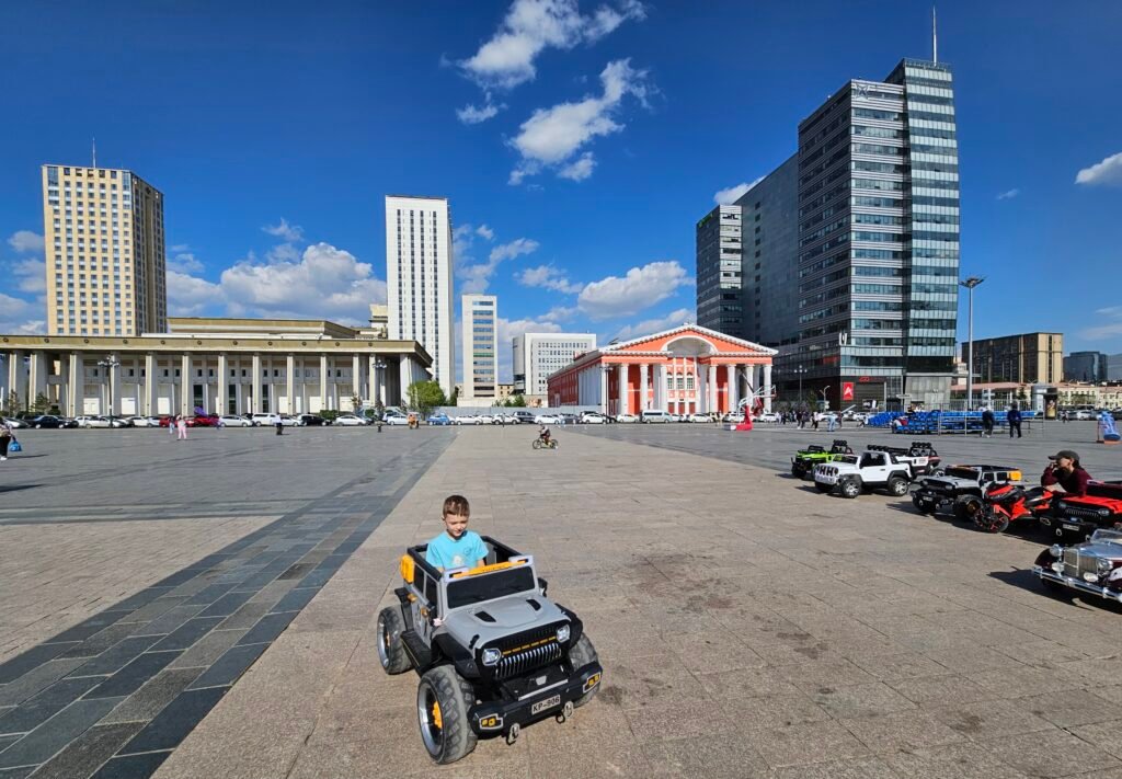 Kids riding rental bikes around Sukhbaatar Square