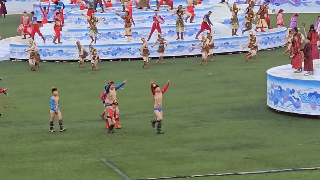 Traditional Mongolian wrestling match at Naadam