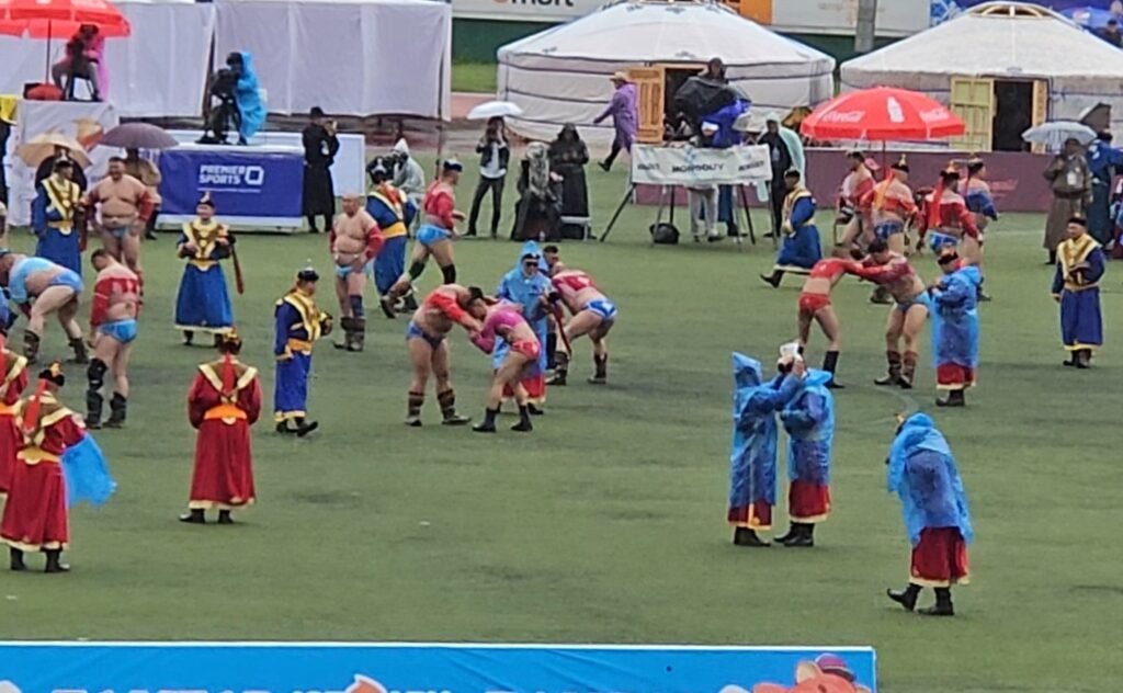 Mongolian wrestlers competing at Naadam Festival