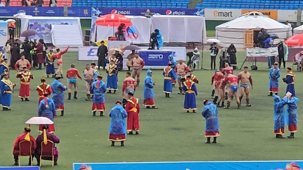 Wrestlers in zodog and shuudag competing at Naadam Festival