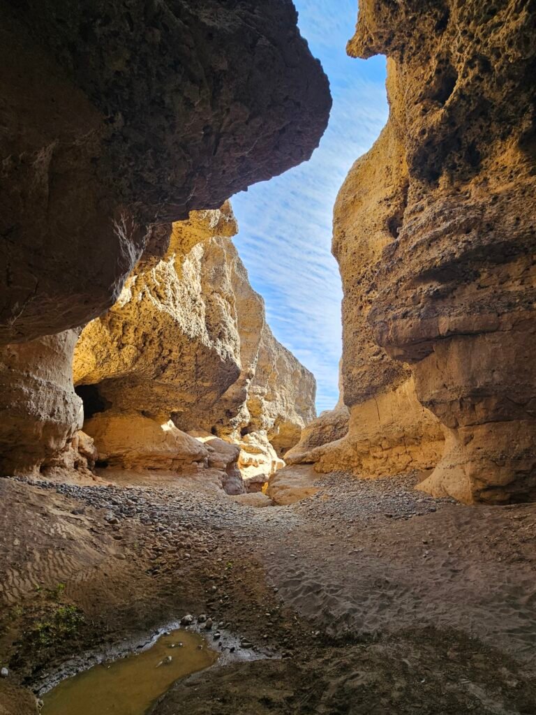 Climbing down into Sesriem Canyon, Namibia, with kids