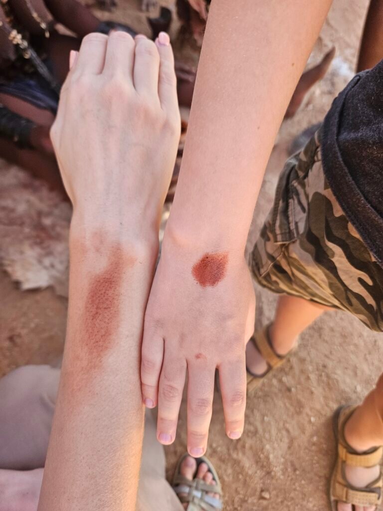 Himba community members performing a traditional dance