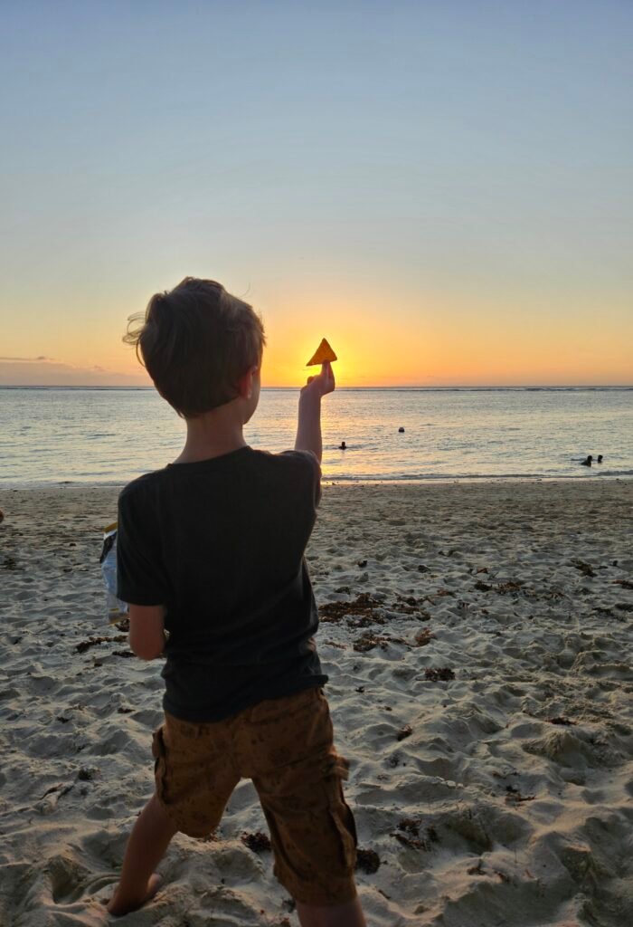 Playing on Flic en Flac Beach in Mauritius with our 7-year-old