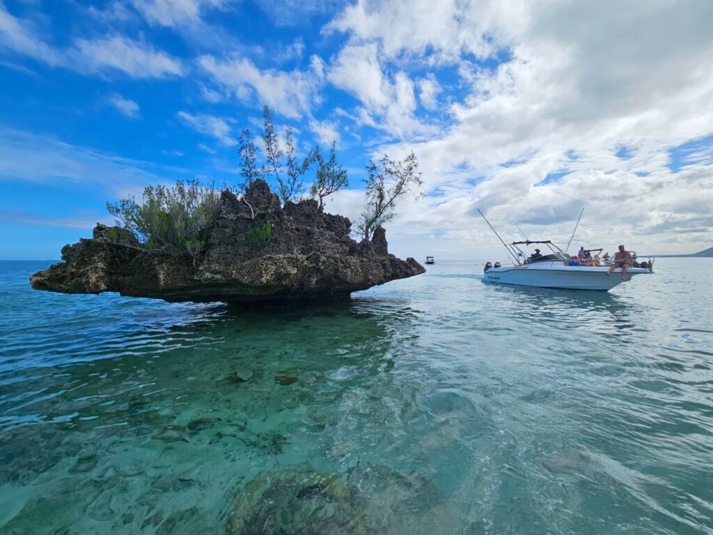Crystal Rock rising from turquoise water off Mauritius