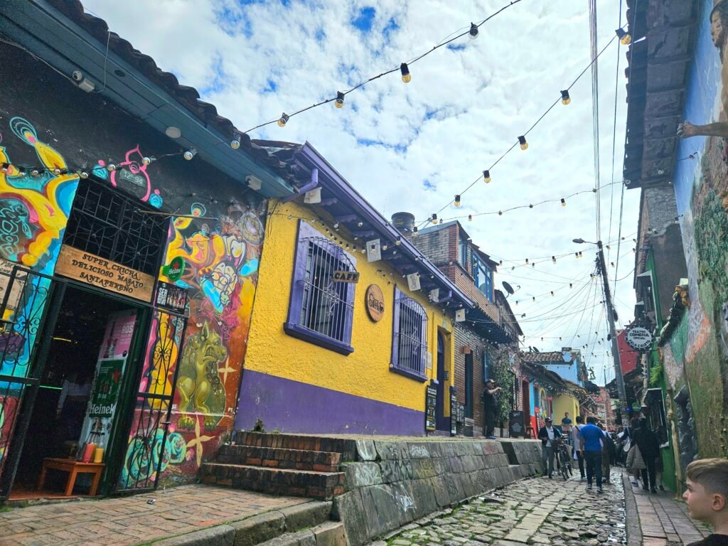 Colourful graffiti-covered street with fairy lights in La Candelaria, Bogotá