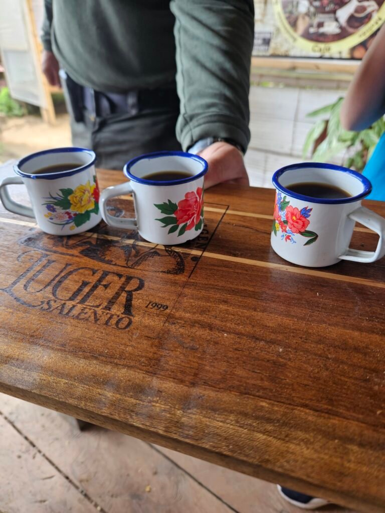 Three cups of Colombian coffee served on a wooden table in Salento