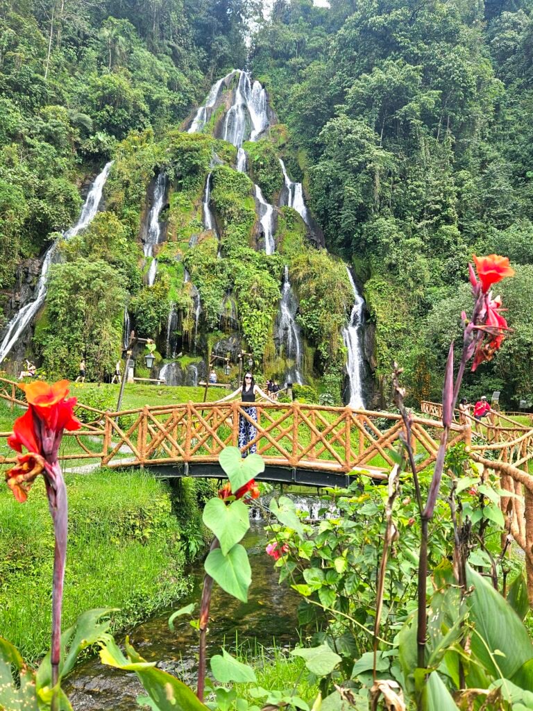 Waterfall cascading through a garden near the Cocora Valley, Colombia