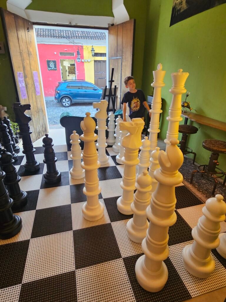 Board games on the shelves at High Rollers Board Game Café, Antigua