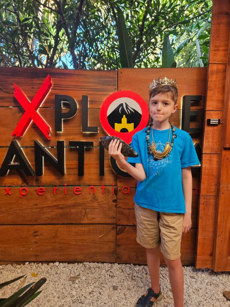 Child completing the Xplore Antigua Mysteries of Antigua treasure hunt