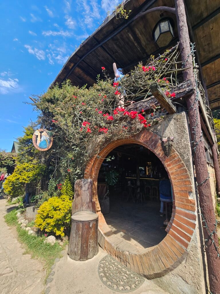 Family exploring Hobbitenango, a fantasy-themed attraction near Antigua