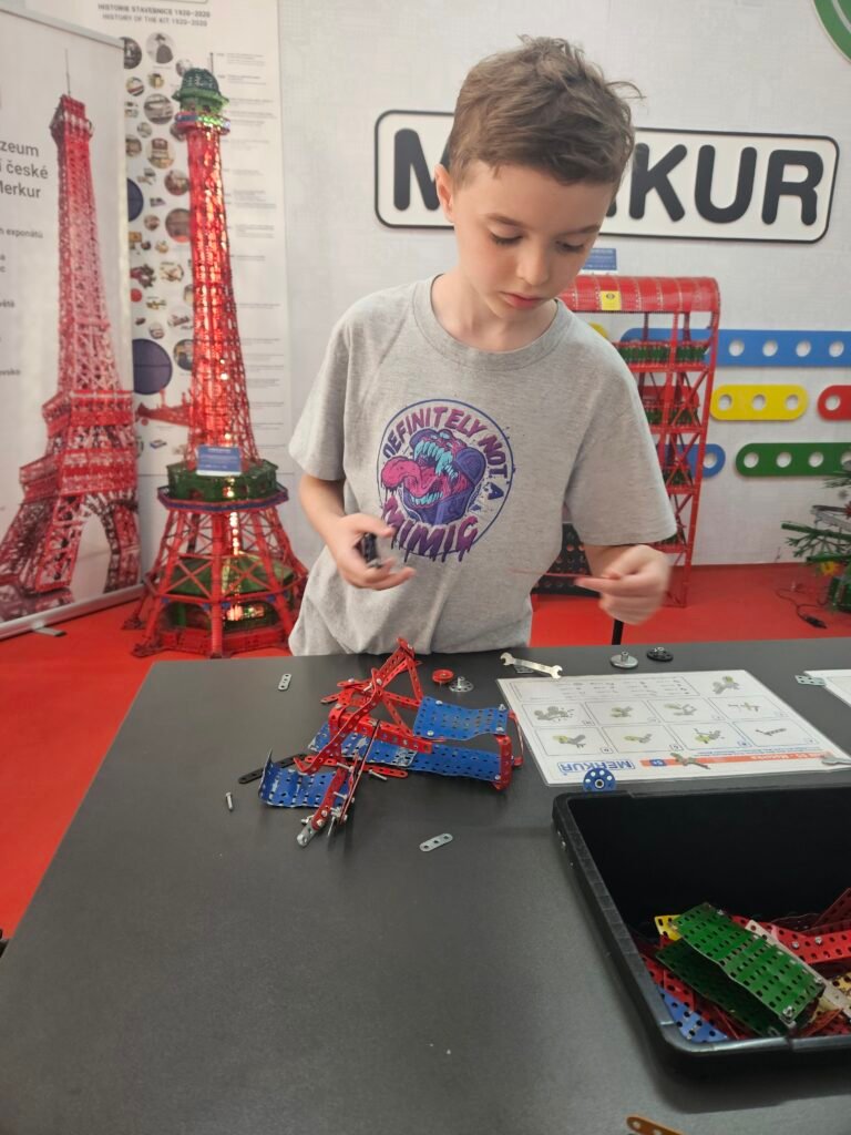 Boy building a model with Merkur construction toys at the Steel Art Museum in Prague