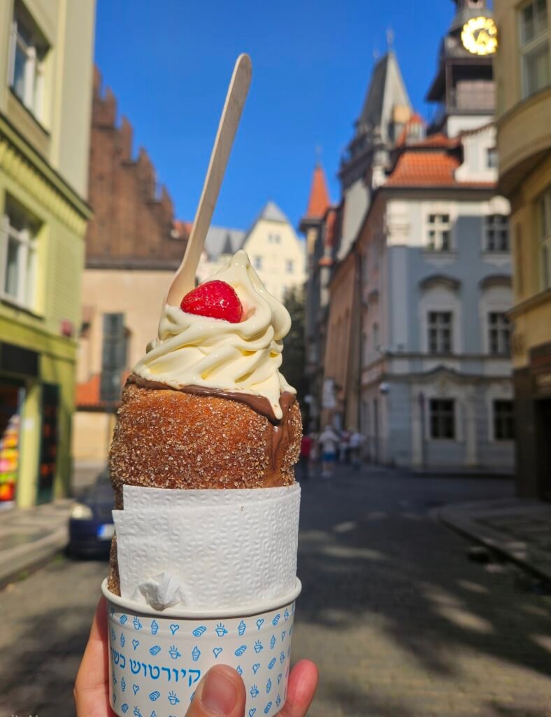 Trdelník chimney cake filled with soft-serve ice cream, a popular Prague street food