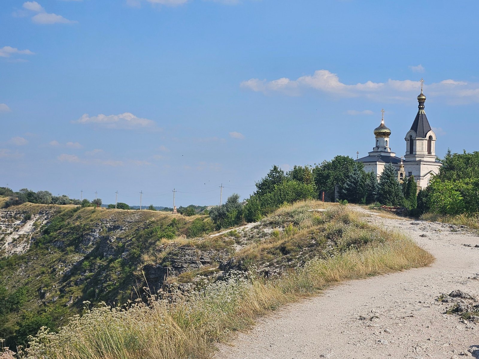 Rock-hewn monastery and cliffs above the Răut River at Old Orhei, Moldova