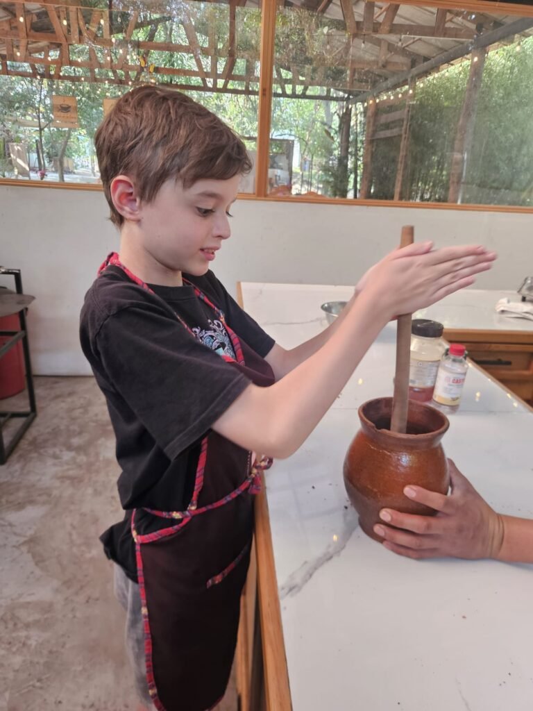Child taking part in a chocolate-making workshop in Antigua Guatemala