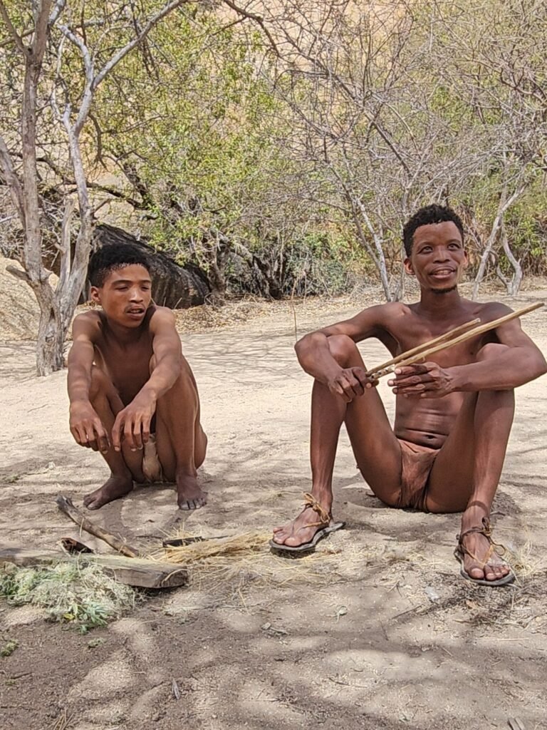 Family engaging with San community members during a cultural visit