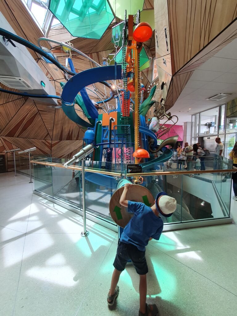 Kids exploring a fun attraction during family travel