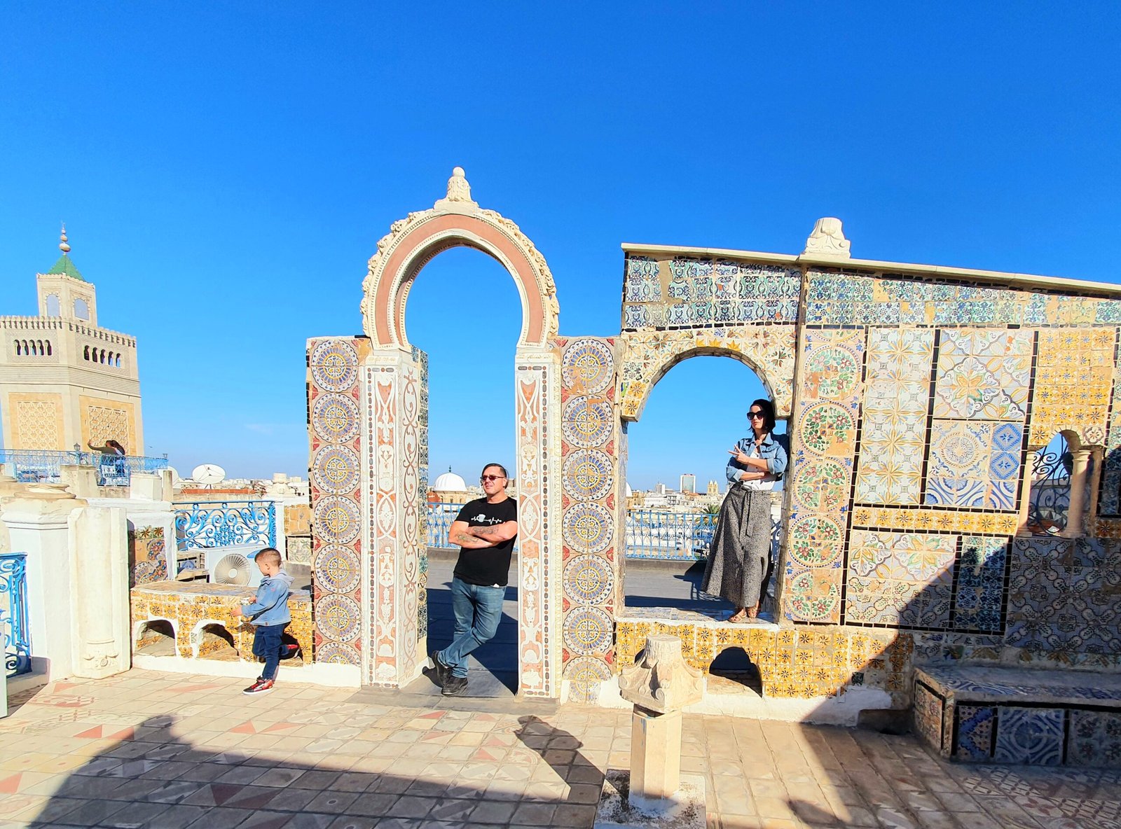 Our family on a tiled rooftop terrace overlooking the medina in Tunis, Tunisia